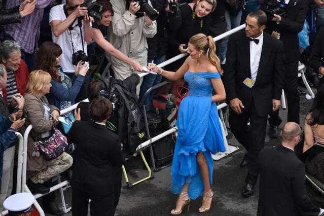 Blake Lively signs autographs at “The BFG (Le Bon Gros Geant – Le BGG)” premiere during the 69th annual Cannes Film Festival at the Palais des Festivals on May 14, 2016 in Cannes, France. (Photo by Clemens Bilan/Getty Images)