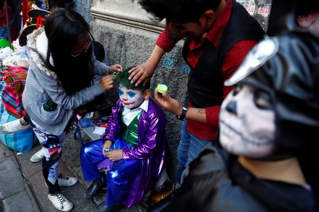 A kid dressed as the Joker is pictured during Halloween celebrations in La Paz, Bolivia, October 31, 2019. (Photo by Kai Pfaffenbach/Reuters)
