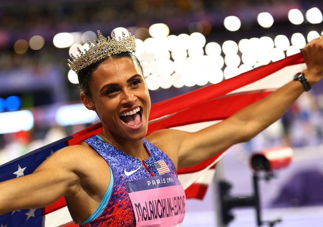 Sydney McLaughlin-Levrone of the United States celebrates after winning gold in the women's 400-meter hurdles in a world record time at the Paris Olympics on August 8, 2024, at Stade de France in Saint-Denis, near Paris. (Photo by Kai Pfaffenbach/Reuters)