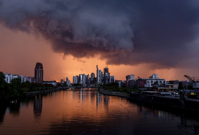 Dark clouds drift over the buildings of the banking district in Frankfurt, Germany, as a thunderstorm approaches on Friday, September 22, 2023. (Photo by Michael Probst/AP Photo)