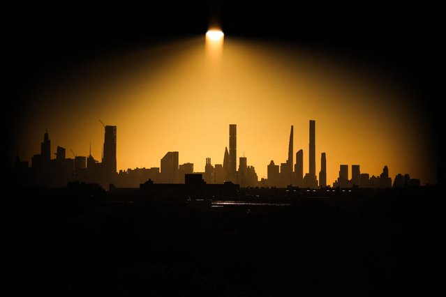 The Manhattan skyline is seen at sunset from Louis Armstrong Stadium during the US Open tennis tournament at the USTA Billie Jean King National Tennis Center in New York City, on September 2, 2024. (Photo by Charly Triballeau/AFP Photo)