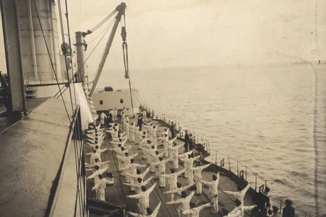 Sailors take part in morning exercises aboard a German Navy warship in this 1917 handout picture taken at an unknown location at sea. This picture is part of a previously unpublished set of World War One (WWI) images from a private collection. The pictures offer an unusual view of varied and contrasting aspects of the conflict, from high tech artillery to mobile pigeon lofts, and from officers partying in their headquarters to the grim reality of life and death in the trenches. The year 2014 marks the centenary of the start of the war. (Photo by Reuters/Archive of Modern Conflict London)