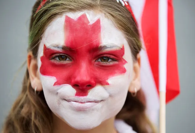 Clara Swain looks on with a painted face as she participates in the East York Toronto Canada Day parade, as the country marks its 150th anniversary with “Canada 150” celebrations, in Toronto, Ontario, Canada July 1, 2017. (Photo by Mark Blinch/Reuters)