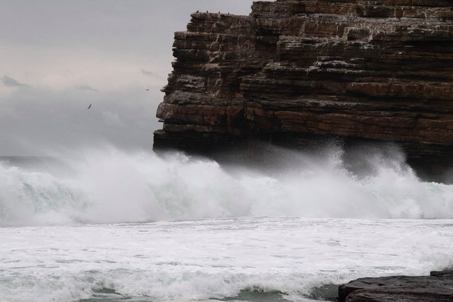 Waves break at Dias Beach at the Cape Point reserve, from where a 17 year old French schoolboy on a rugby tour, is missing in the sea, on August 08, 2024, in Cape Town. Medhi Narjissi, a player on the French under-18 team, has gone missing at sea in South Africa, on the sidelines of an international tournament, the French Rugby Federation (FFR) announced on Wednesday. (Photo by Rodger Bosch/AFP Photo)