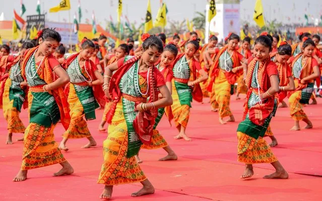 Artists perform traditional Bodo dance during a public rally of India's Prime Minister Narendra Modi on the occasion of celebrations for tripartite Bodo Peace Accord at Khargaon-Tengapara area in Kokrajhar of northeastern state of Assam on February 7, 2020. (Photo by Kulendu Kalita/AFP Photo)