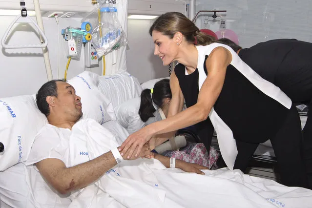 Spain's Princess Letizia speaks with one of the victims of the van attacks at a hospital in Barcelona , Spain, Saturday, August 19, 2017. Police on Friday shot and killed five people carrying bomb belts who were connected to the Barcelona van attack, as the manhunt intensified for the perpetrators of Europe's latest rampage claimed by the Islamic State group. (Photo by Spanish Royal Palace, Pool Photo via AP Photo)