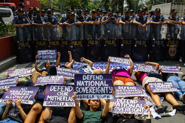 Women Youth and Student groups led by Gabriela stage a protest outside the US embassy in the run up to International Women's Day in Manila on March 6, 2020 (Photo by Maria Tan/AFP Photo)