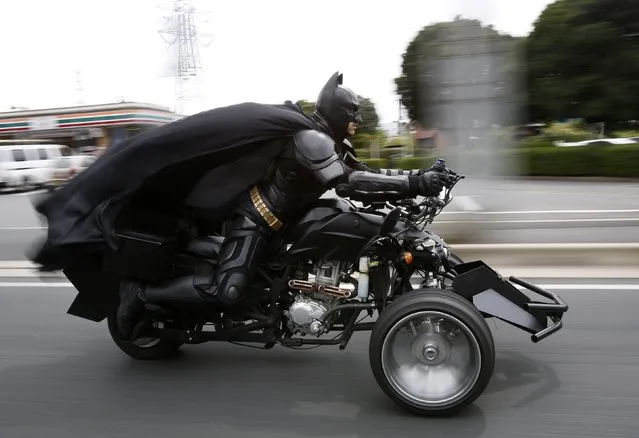 A 41-year-old man going by the name of Chibatman rides his “Chibatpod” on the road in Chiba, east of Tokyo, August 31, 2014. (Photo by Yuya Shino/Reuters)