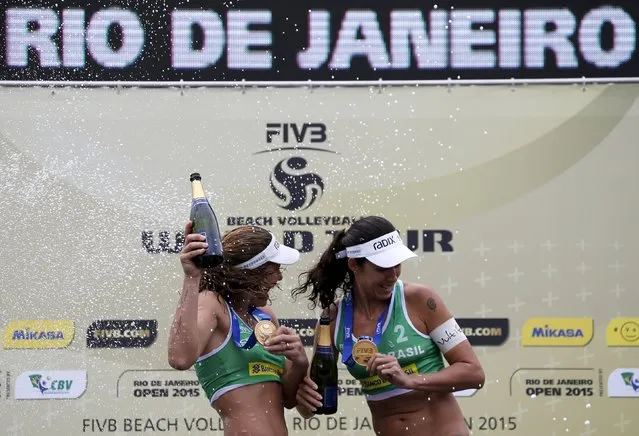 Larissa Franca (L) and Talita Antunes of Brazil celebrate after winning their Rio Open women's beach volleyball final match against compatriots Agatha Bednarczuk and Barbara Seixas on Copacabana beach in Rio de Janeiro, Brazil, September 6, 2015. (Photo by Sergio Moraes/Reuters)