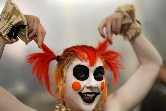 A reveler takes part in the Theatre Bizarre festival, a Halloween celebration that is returning in person for the first time since the COVID-19 pandemic, in Detroit, Michigan, U.S., October 14, 2022. (Photo by Dieu-Nalio Chery/Reuters)