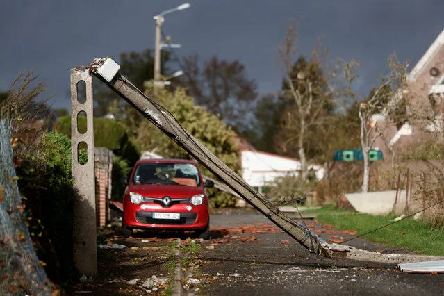 View of a snapped utility pole amid tornado damage in Bihucourt, northern France on October 24, 2022. (Photo by Benoit Tessier/Reuters)