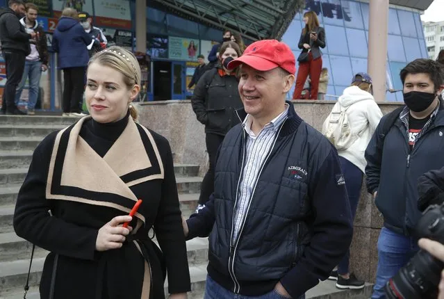 In this picture taken on Wednesday, May 26, 2020, Valery Tsepkalo, a potential candidate in the upcoming presidential election, smiles as his wife Veronica looks on in Minsk, Belarus. The central elections commission in Belarus has rejected a top challenger's bid to run against authoritarian President Alexander Lukashenko in this summer's election. Tsepkalo, a former ambassador to the United States and a founder of a successful high-technology park, submitted 160,000 signatures on petitions to get on the ballot for the Aug. 9 election, but the commission said only 75,000 were valid less than the 100,000 needed. (Photo by Sergei Grits/AP Photo)