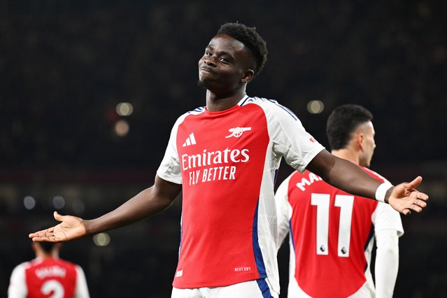 Bukayo Saka of Arsenal celebrates scoring his team's second goal during the Premier League match between Arsenal FC and Fulham FC at Emirates Stadium on April 01, 2025 in London, England. (Photo by Stuart MacFarlane/Arsenal FC via Getty Images)