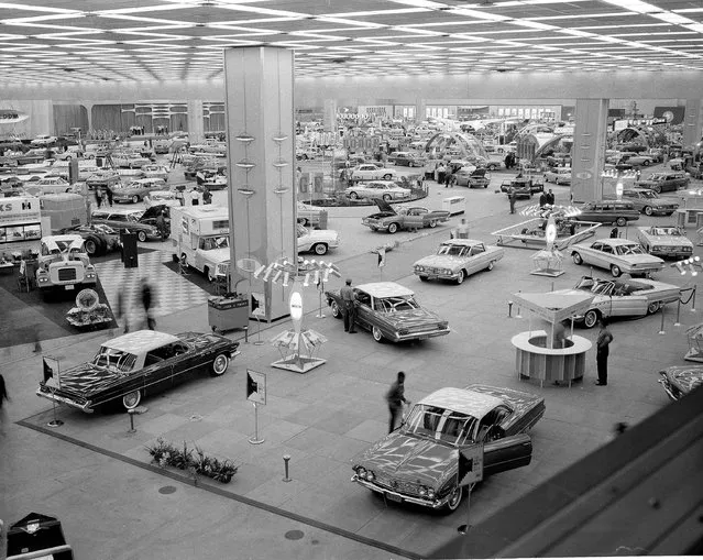 In this October 14, 1960 file photo, people visit the National Auto Show at Cobo Hall in Detroit. In 2013, more than 795,000 people, including 5,200 journalists from around the world attended the show. (Photo by AP Photo)