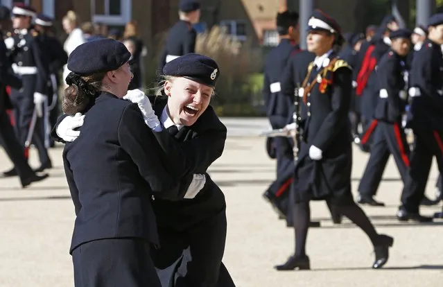 Students react after a surprise visit from Britain's Prince Harry to The Duke of York's Royal Military School in Dover, southern England, September 28, 2015. (Photo by Eddie Keogh/Reuters)