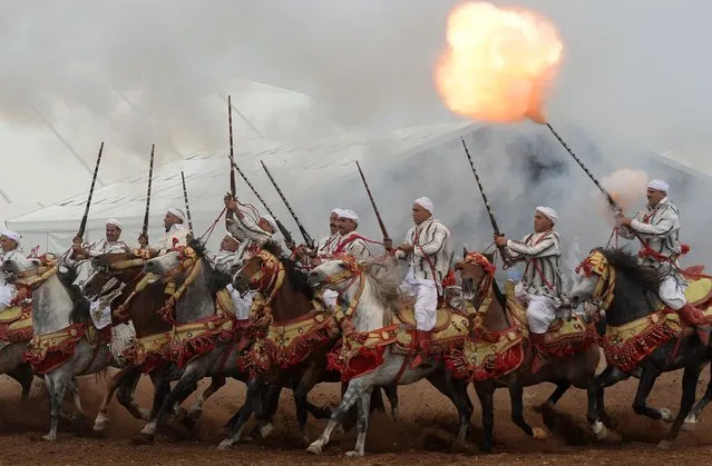Moroccan horsemen perform during the 7th edition of the “Salon du Cheval” in the port city of El Jadida on October 21, 2014. (Photo by Fadel Senna/AFP Photo)