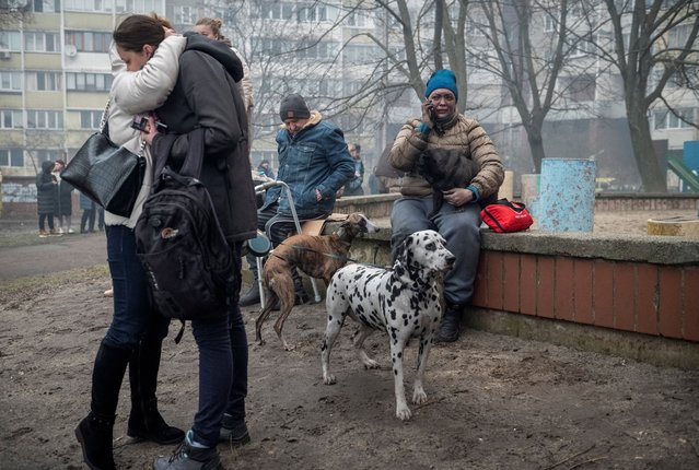 Local residents react as they stand near their residential building damaged during a Russian missile strike in Kyiv, Ukraine on February 7, 2024. (Photo by Danylo Antoniuk/Reuters)
