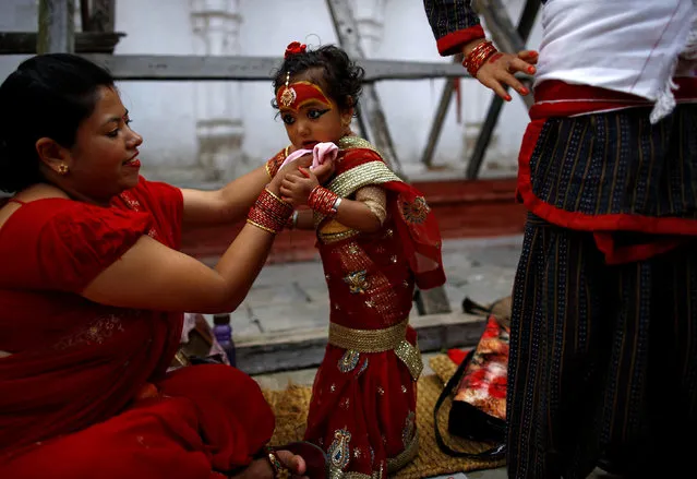 A young girl dressed as the Living Goddess Kumari takes part in the Kumari Puja festival in Kathmandu, Nepal September 14, 2016. The festival is a gathering in which young girls pose as the Living Goddess Kumari and are worshipped by people in belief that their children will remain healthy. (Photo by Navesh Chitrakar/Reuters)