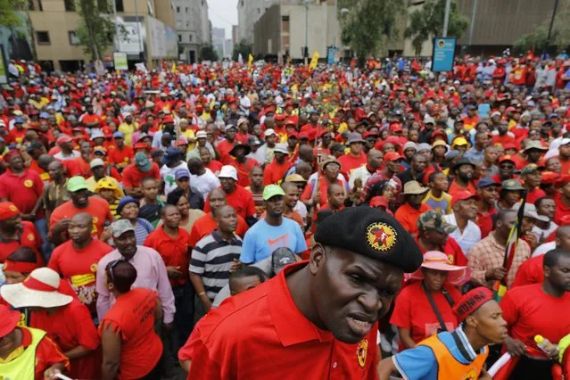 Some of thousands of members of the NUMSA (South African Union of Metal Workers) march to highlight corruption within the government during a mass anti corruption march in Johannesburg, South Africa, 14 October 2015. (Photo by Kim Ludbrook/EPA)