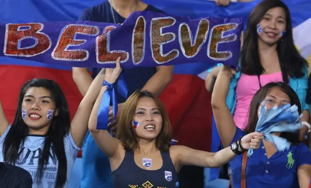 Fans of the Philippines cheer for their team during their Suzuki Cup Group A soccer match against Vietnam at My Dinh Stadium in Hanoi November 28, 2014. Vietnam booked their place in the semi-finals of the AFF Suzuki Cup on Friday with a 3-1 win over the Philippines at the My Dinh National Stadium in Hanoi. (Photo by Reuters/Stringer)