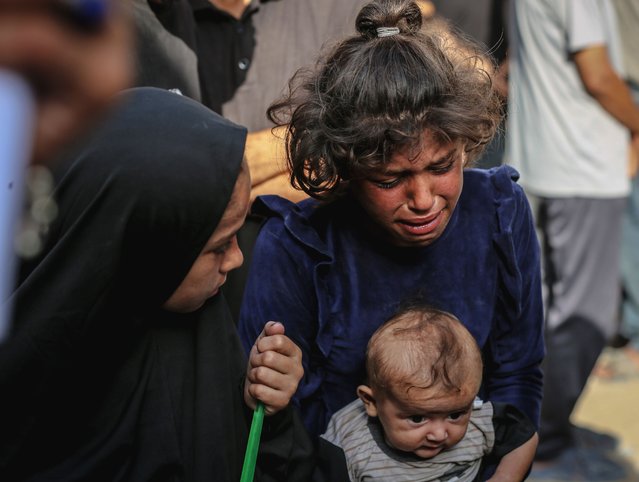 Relatives of the Palestinians, who died as a result of the Israeli army attacks on Gaza City mourn as the dead bodies were taken from the al-Shifa Hospital for burial in Gaza City, Gaza on August 19, 2025. (Photo by Saeed M. M. T. Jaras/Anadolu via Getty Images)