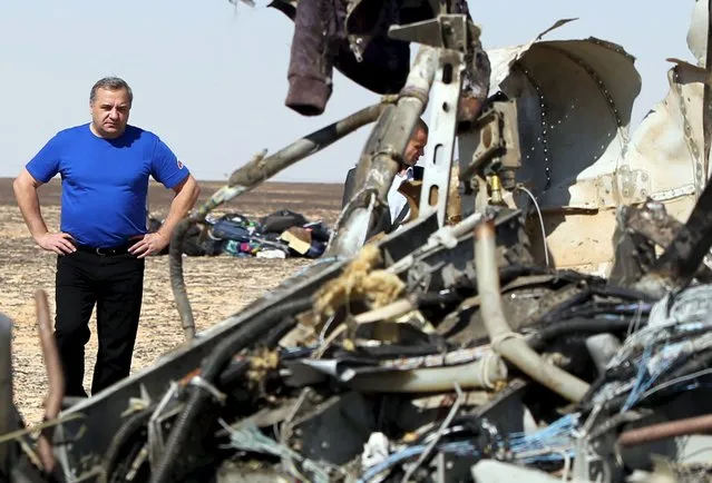 Russian Emergencies Minister Vladimir Puchkov looks at debris from a Russian airliner at its crash site at the Hassana area in Arish city, north Egypt, November 1, 2015. (Photo by Mohamed Abd El Ghany/Reuters)