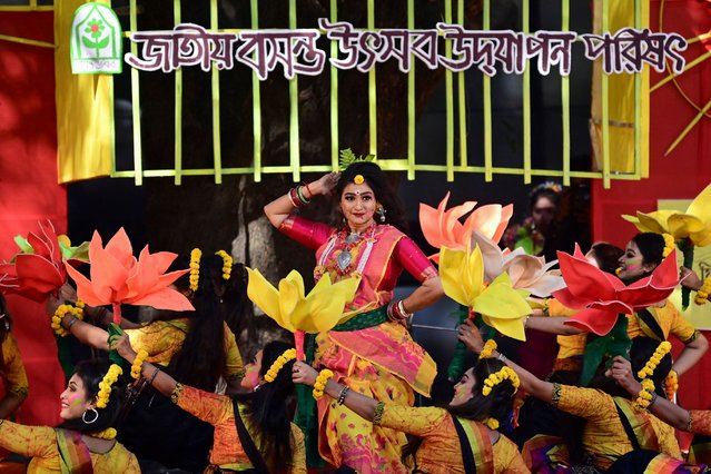 Dancers perform a traditional dance on the occasion of “Basanta Utsab'” or the Spring Festival, in Dhaka on February 14, 2023. (Photo by Munir Uz Zaman/AFP Photo)