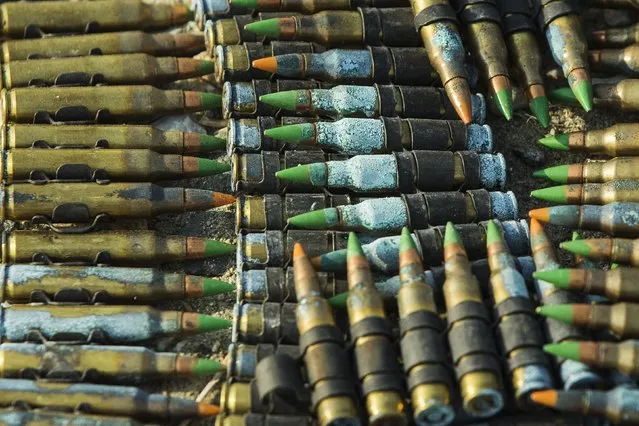 Corroded rounds of machine gun ammunition sit in a pile after being discarded by U.S. soldiers from the 3rd Cavalry Regiment, during a training mission near forward operating base Gamberi, in the Laghman province of Afghanistan, December 15, 2014. (Photo by Lucas Jackson/Reuters)