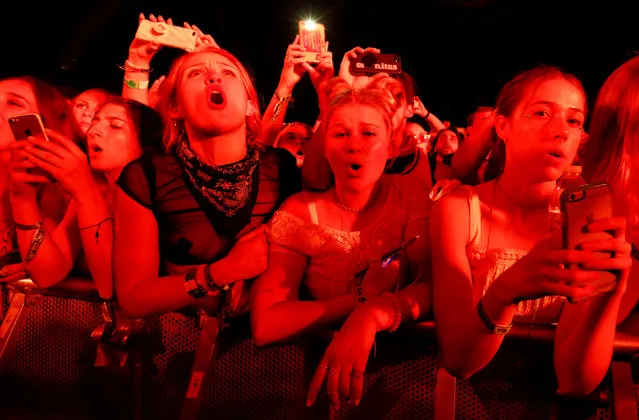 Concertgoers watch a performance by Post Malone at the Coachella Valley Music and Arts Festival in Indio, California, U.S., April 15, 2018. (Photo by Mario Anzuoni/Reuters)