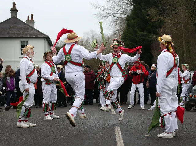 The Chanctonbury Ring Morris Men perform for locals at the Frankland Arms pub on December 26, 2014 in Washington, England. The Morris Men perform various dances and a traditional Mummers play at different pubs on Boxing day. (Photo by Peter Macdiarmid/Getty Images)