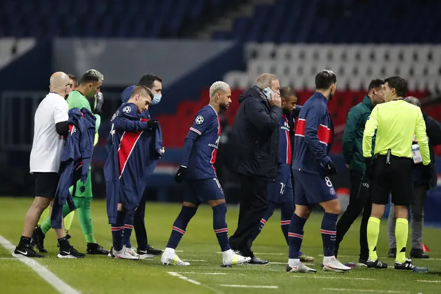 Players of Paris Saint Germain leave the pitch, during the Champions League group H soccer match between Paris Saint Germain and Istanbul Basaksehir at the Parc des Princes stadium in Paris, Tuesday December 8 , 2020. Basaksehir's assistant coach Pierre Webo was shown a straight red card in the 16th minute before the players refused to continue the match amid allegations of racism by one of the match officials. (Photo by Francois Mori/AP Photo)