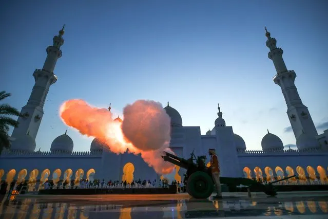 A cannon is fired at the Sheikh Zayed Grand Mosque in Abu Dhabi to mark the end of fasting and start of Iftar on the first Friday of Ramadan on March 24, 2023. (Photo by Victor Besa/The National)