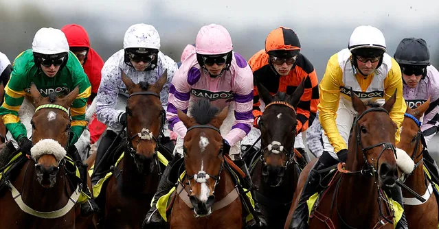 Riders are seen on the second day of the Grand National Festival horse race meeting at Aintree Racecourse in Liverpool, north-west England on April 14, 2023. (Photo by Jason Cairnduff/Reuters)