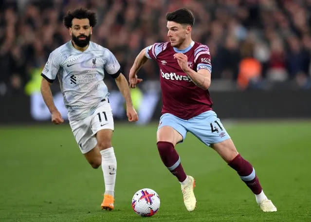 Declan Rice of West Ham United takes on Mohamed Salah of Liverpool during the Premier League match between West Ham United and Liverpool FC at London Stadium on April 26, 2023 in London, England. (Photo by Justin Setterfield/Getty Images)