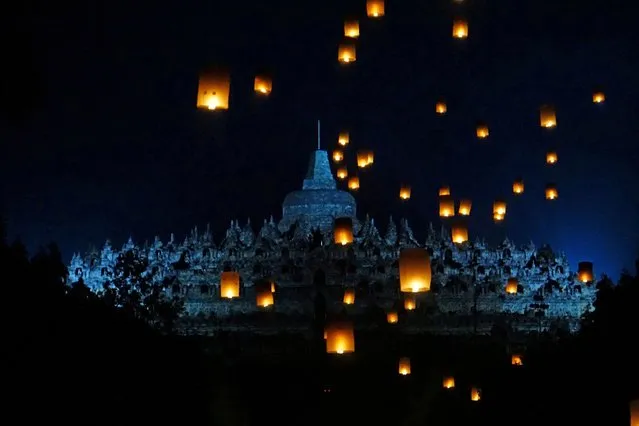 Paper lanterns are seen flying near Borobudur temple during the festival to mark the Vesak Day celebration in Magelang, Central Java province, Indonesia on June 4, 2023, in this photo taken by Antara Foto. (Photo by Anis Efizudin/Antara Foto via Reuters)