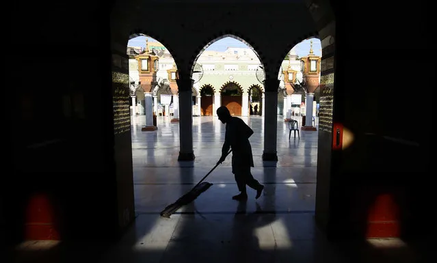 A man cleans a Mosque ahead of the holy month of Ramadan during coronavirus pandemic in Karachi, Pakistan, 12 April 2021. Ramadan is the ninth month of the Islamic calendar. Muslims observe it by fasting - neither eating nor drinking – between dawn and sunset. Fasting is the fourth of the five pillars of Islam, the other four being declaration of faith, the observance of the five daily prayers, the payment of alms and the performance of a pilgrimage, or Hajj in Saudi Arabia. (Photo by Shahzaib Akber/EPA/EFE)