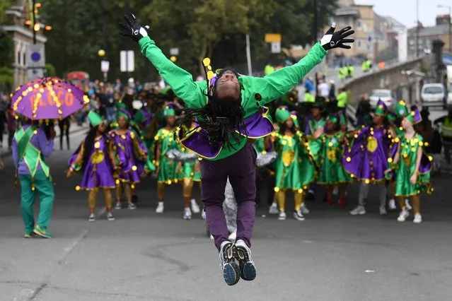 Performers take part in the Notting Hill Carnival Family Day in London, Britain, 26 August 2018. The street festival celebrates its 52nd anniversary and more than a million people are expected to attend the two-day celebration of Caribbean heritage on 26 and 27 August. (Photo by Neil Hall/EPA/EFE)