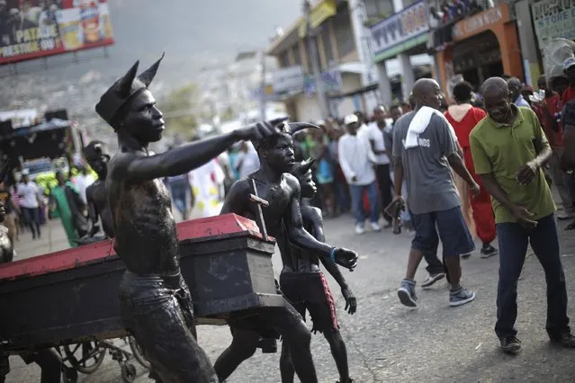 Revellers take part in the National Carnival 2015 annual parade in Port-au-Prince February 15, 2015. (Photo by Andres Martinez Casares/Reuters)