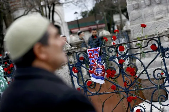A Bayern Munich football club scarf is tied to a railing next to flowers at the Obelisk of Theodosius, the scene of yesterday's suicide bomb attack at Sultanahmet square in Istanbul, Turkey January 13, 2016. A suicide bomber who killed himself and 10 tourists, most of them German, in Istanbul's historic heart had registered with Turkish immigration authorities but was not on any list of known militant suspects, Turkey's interior minister said on Wednesday. (Photo by Murad Sezer/Reuters)