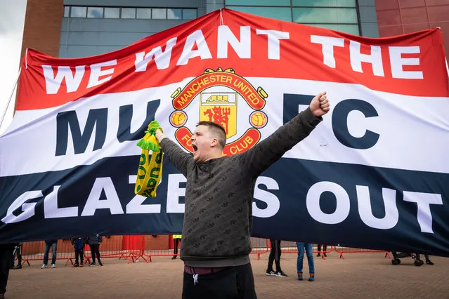 A football fan chants slogans in front of a banner before a protest against the Glazer's ownership of Manchester United in Manchester, United Kingdom on May 2, 2021. (Photo by Andy Barton/SOPA Images/Sipa USA)