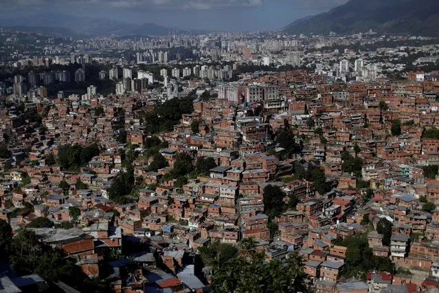 A general view is seen of the slum of Petare, during a visit by Santa Claus to residents in Caracas, Venezuela, December 11, 2016. (Photo by Ueslei Marcelino/Reuters)