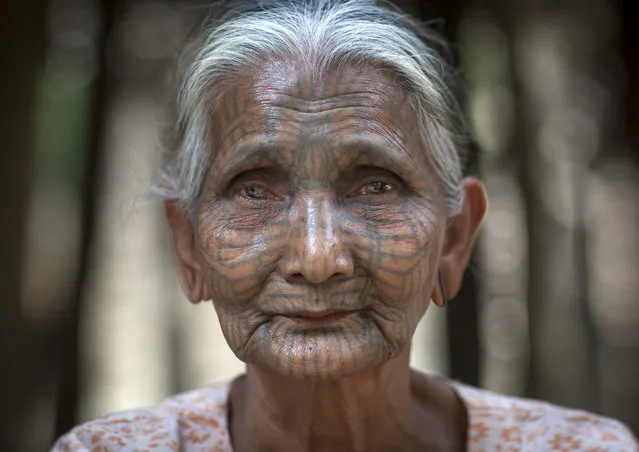A woman from the Chinn tribe who inhabit the Mrauk U region. The design is famous for looking like a spiders web, in February, 2015, in Myanmar, Burma. (Photo by Eric Lafforgue/Barcroft Media)