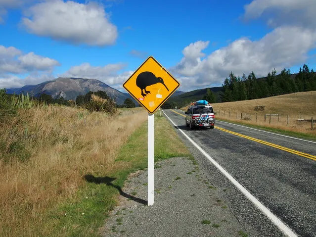 NEW ZEALAND: Holidaymakers drive past a road sign at St. Arnaud on the South Island of News Zealand, March 27, 2016. (Photo by Henning Gloystein/Reuters)