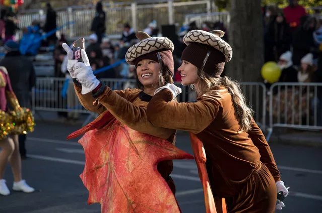 Two women dressed as acorns take a selfie together before the start of the parade in New York on November 22, 2018. Scenes from the 2018 Macy's Thanksgivings day parade on one of the coldest Thanksgivings on record. (Photo by Erik Thomas/NY Post)