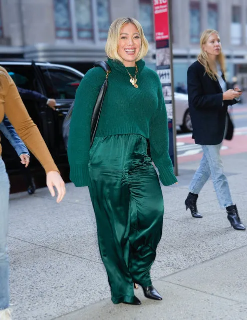 Hilary Duff flashes a radiant smile as she steps out in New York City on November 7, 2023. The 36 year old American actress wore a green sweater, matching trousers, and black heels. (Photo by The Image Direct)