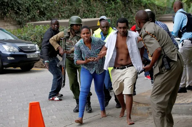 People are evacuated at the scene where explosions and gunshots were heard at the Dusit hotel compound, in Nairobi, Kenya January 15, 2019. (Photo by Thomas Mukoya/Reuters)