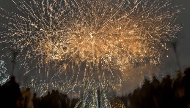 Fireworks light up the sky during New Year's celebrations in Bucharest, Romania. (Photo by Vadim Ghirda/Associated Press)