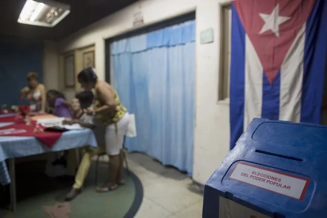 Election officials work at a polling station in Havana April 19, 2015. (Photo by Alexandre Meneghini/Reuters)