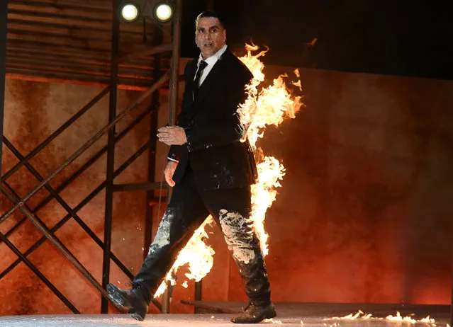 Indian Bollywood actor Akshay Kumar performs a fire stunt during the announcement of the upcoming series “The End” of Amazon Prime Video, in Mumbai on March 5, 2019. (Photo by Sujit Jaiswal/AFP Photo)