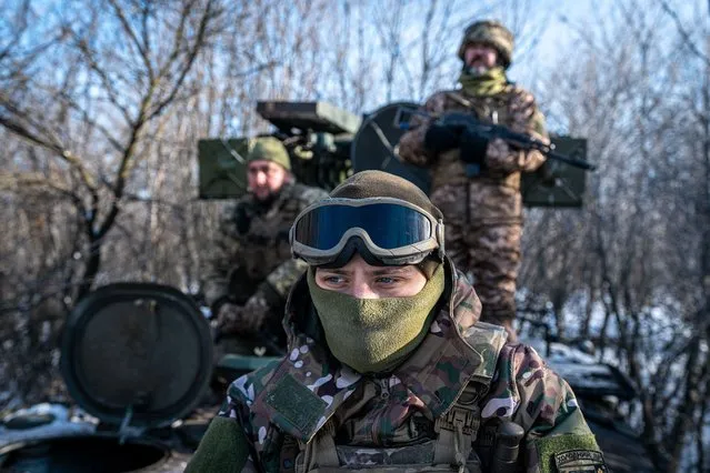 Ukrainian soldiers by an anti-aircraft vehicle towards its position at the Bakhmut frontline, in Donetsk Oblast, Ukraine on January 13, 2024. Drone and air strikes have become increasingly important as the war entered into a stalemate and both sides are heavily fortified. (Photo by Ignacio Marin/Anadolu via Getty Images)